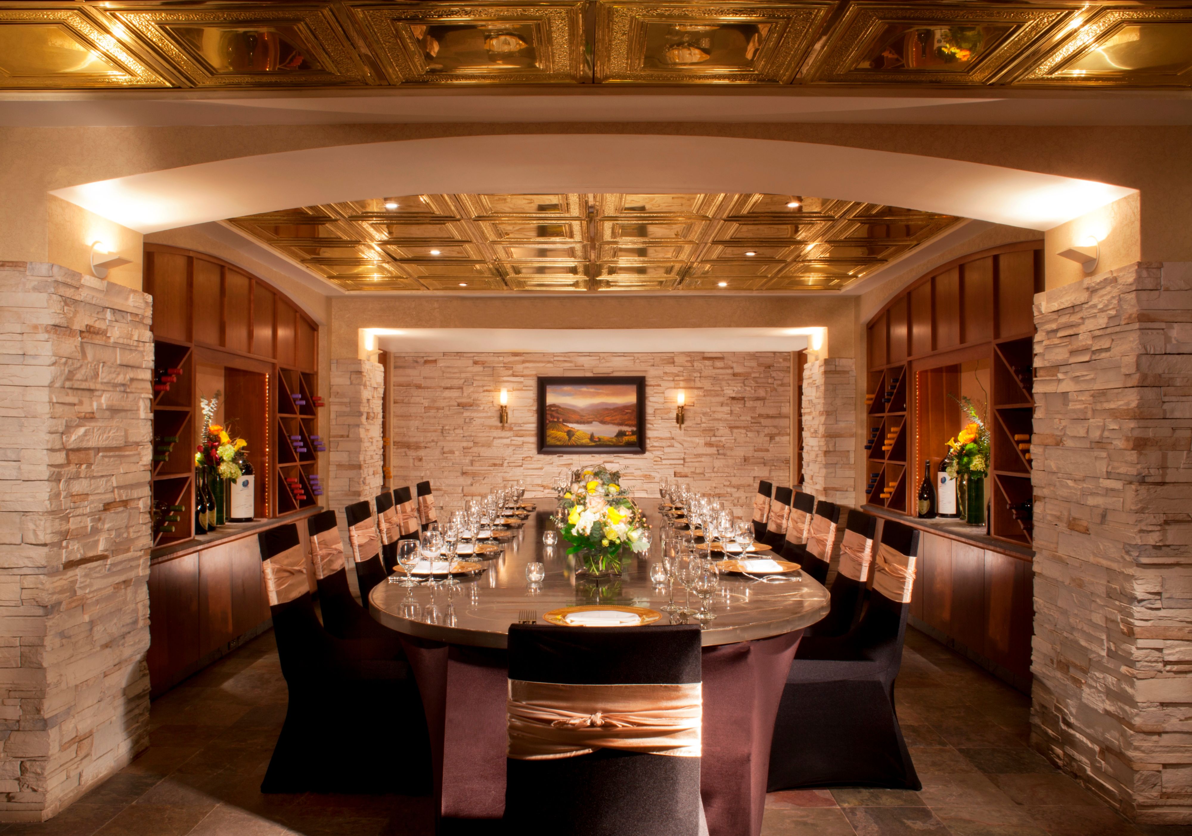 a room with a large table set for a dinner party