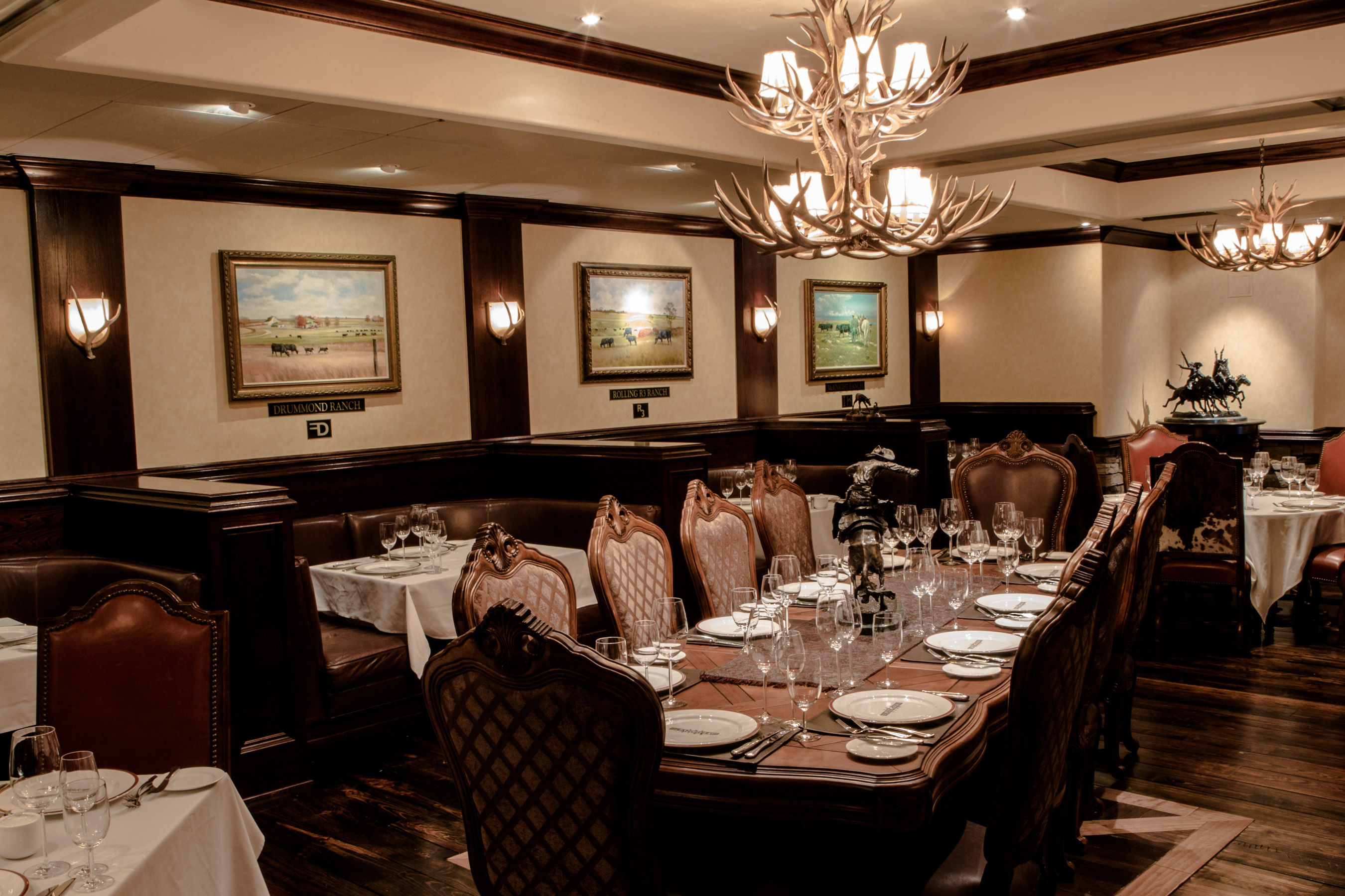 a room with a table set for dinner