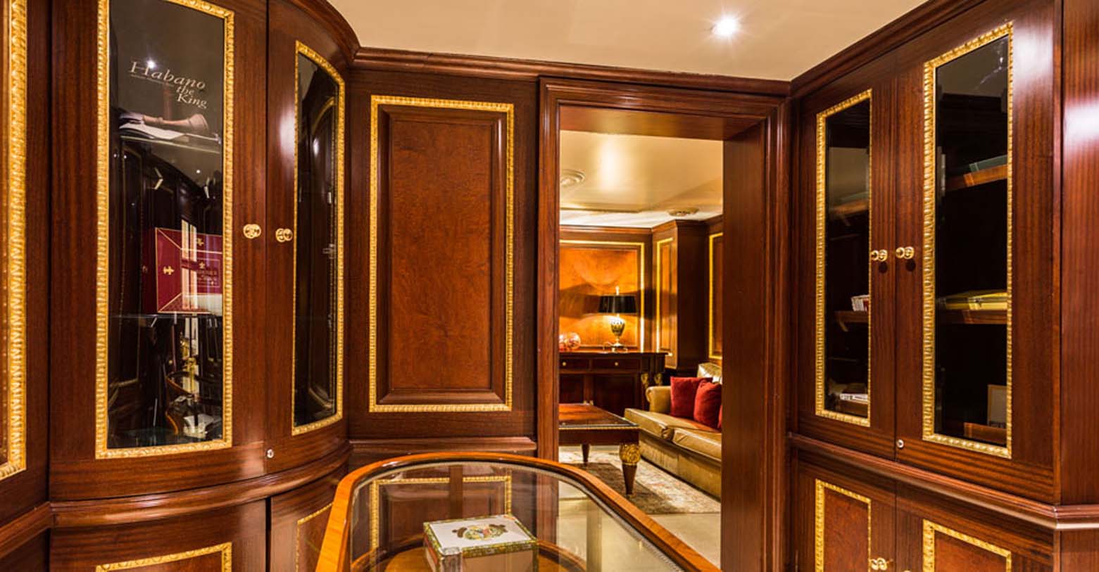 a room with a glass table and a couch