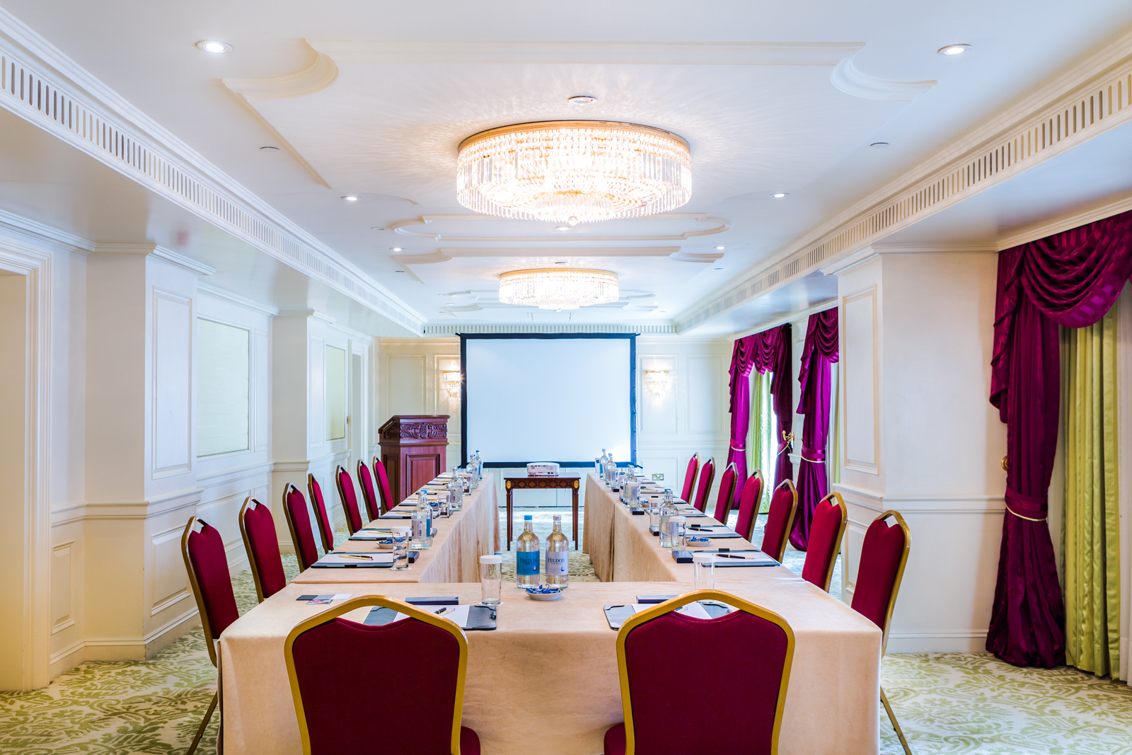 a room with a large table and chairs