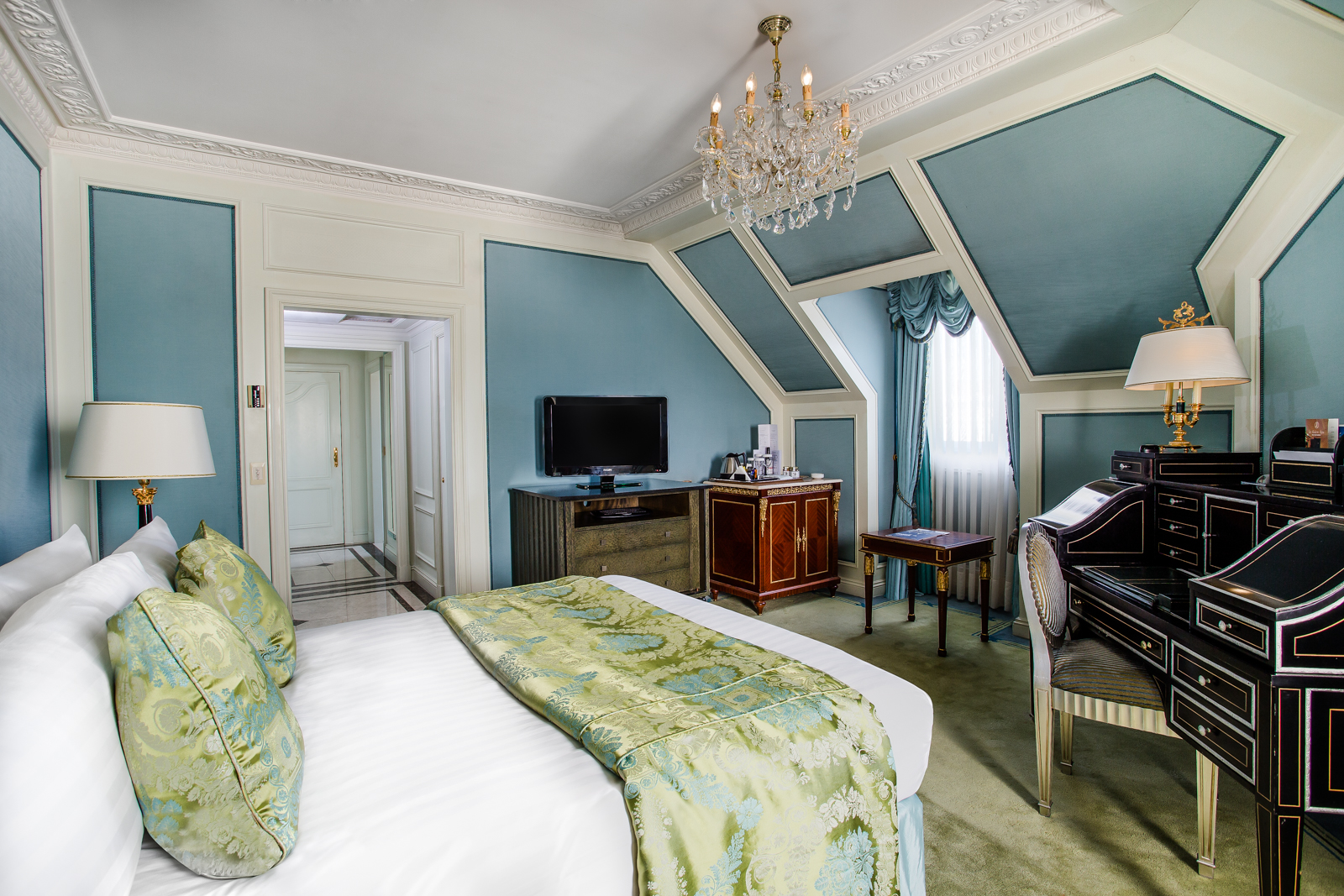 a bedroom with a piano and a bed