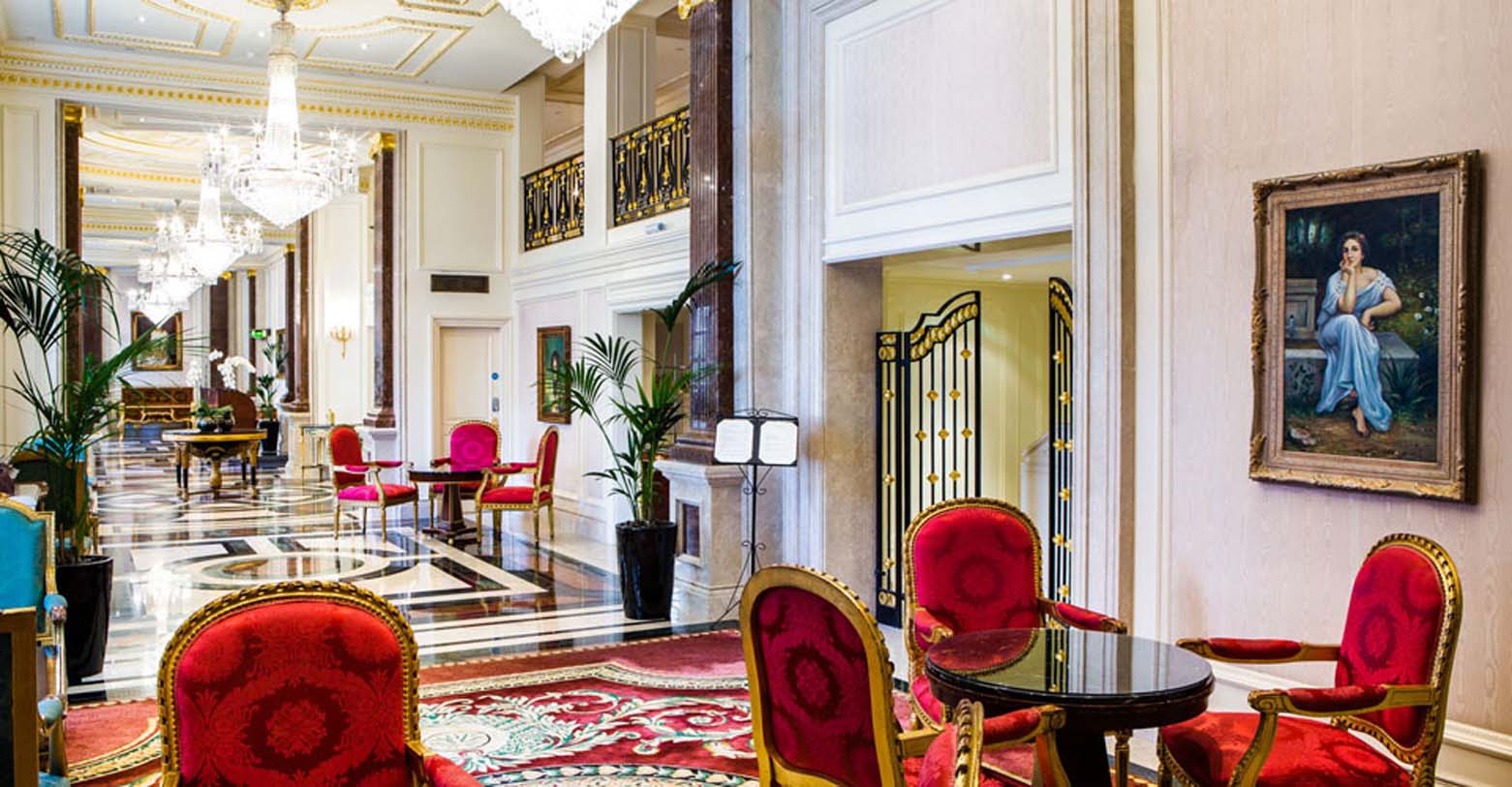 a room with red chairs and a table