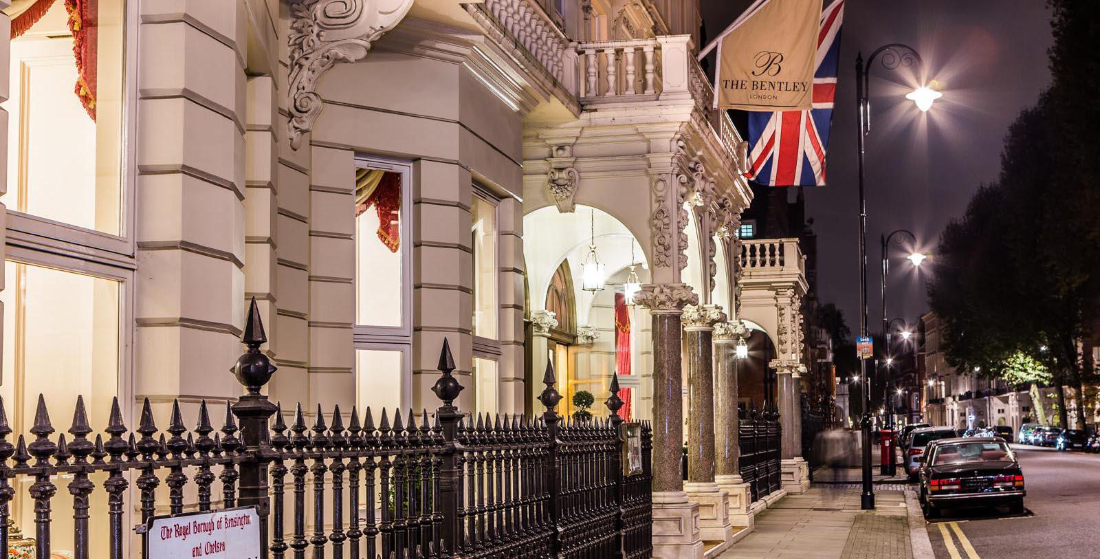 a building with columns and flags