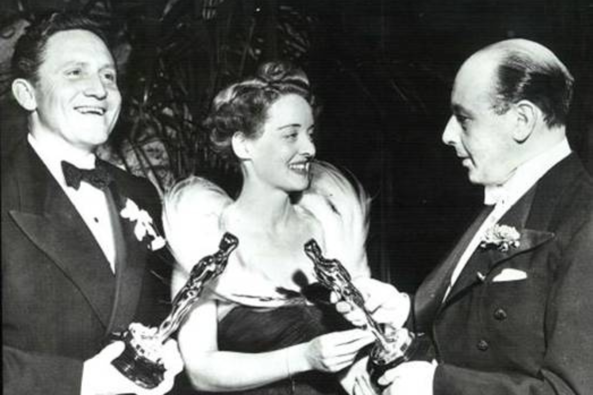 a group of people holding awards