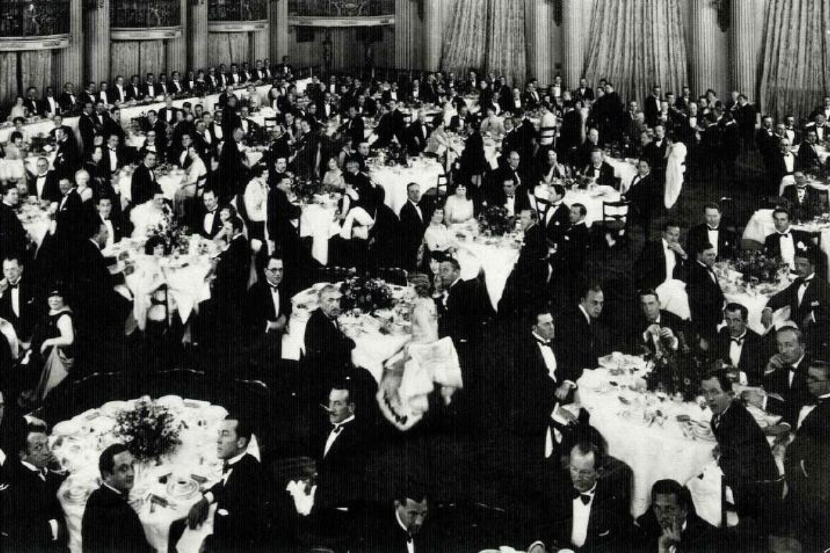 a large group of people sitting at tables