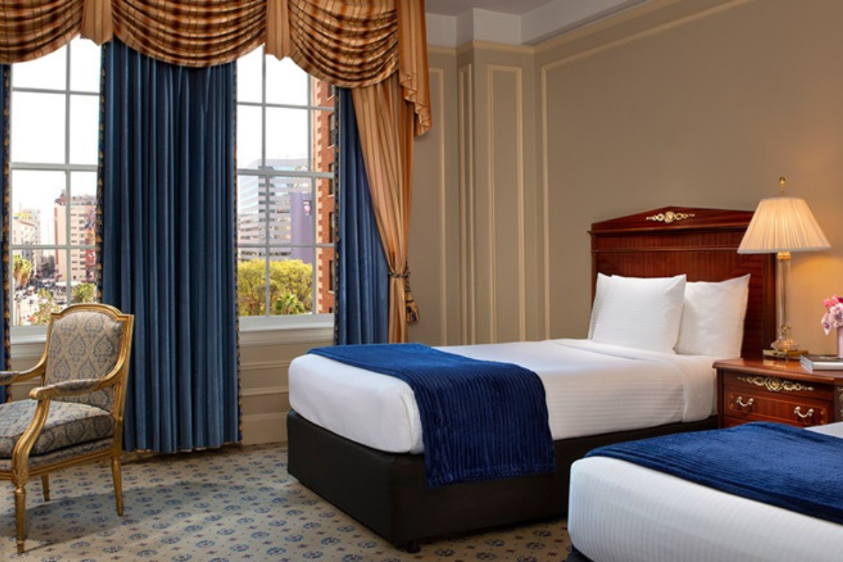 a hotel room with two beds