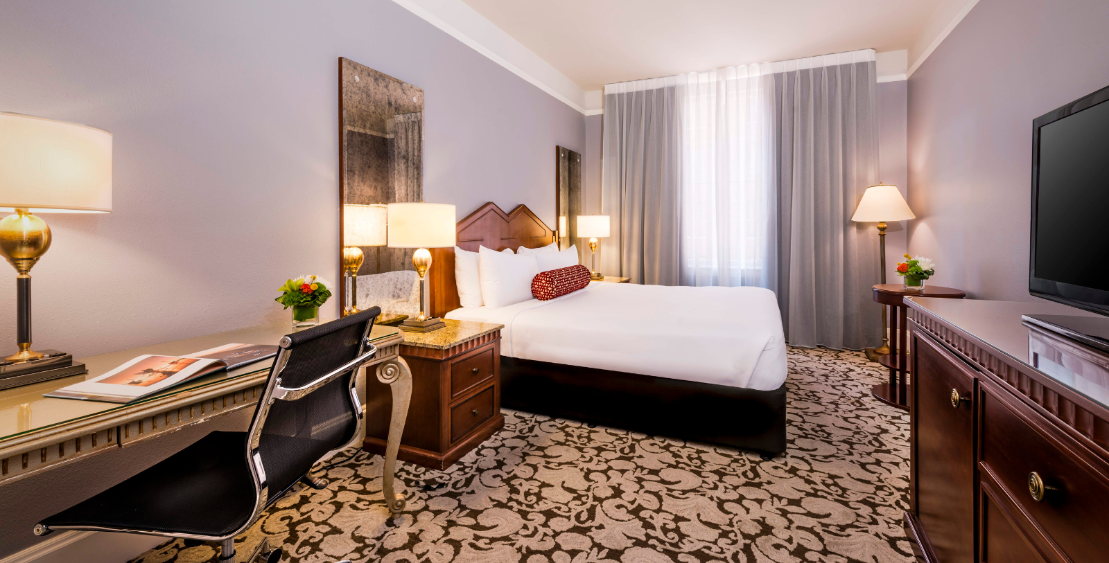 a room with a bed and a desk