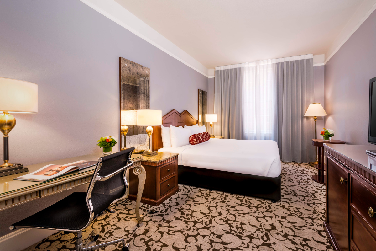 a room with a bed and a desk