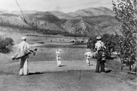 a group of people playing golf