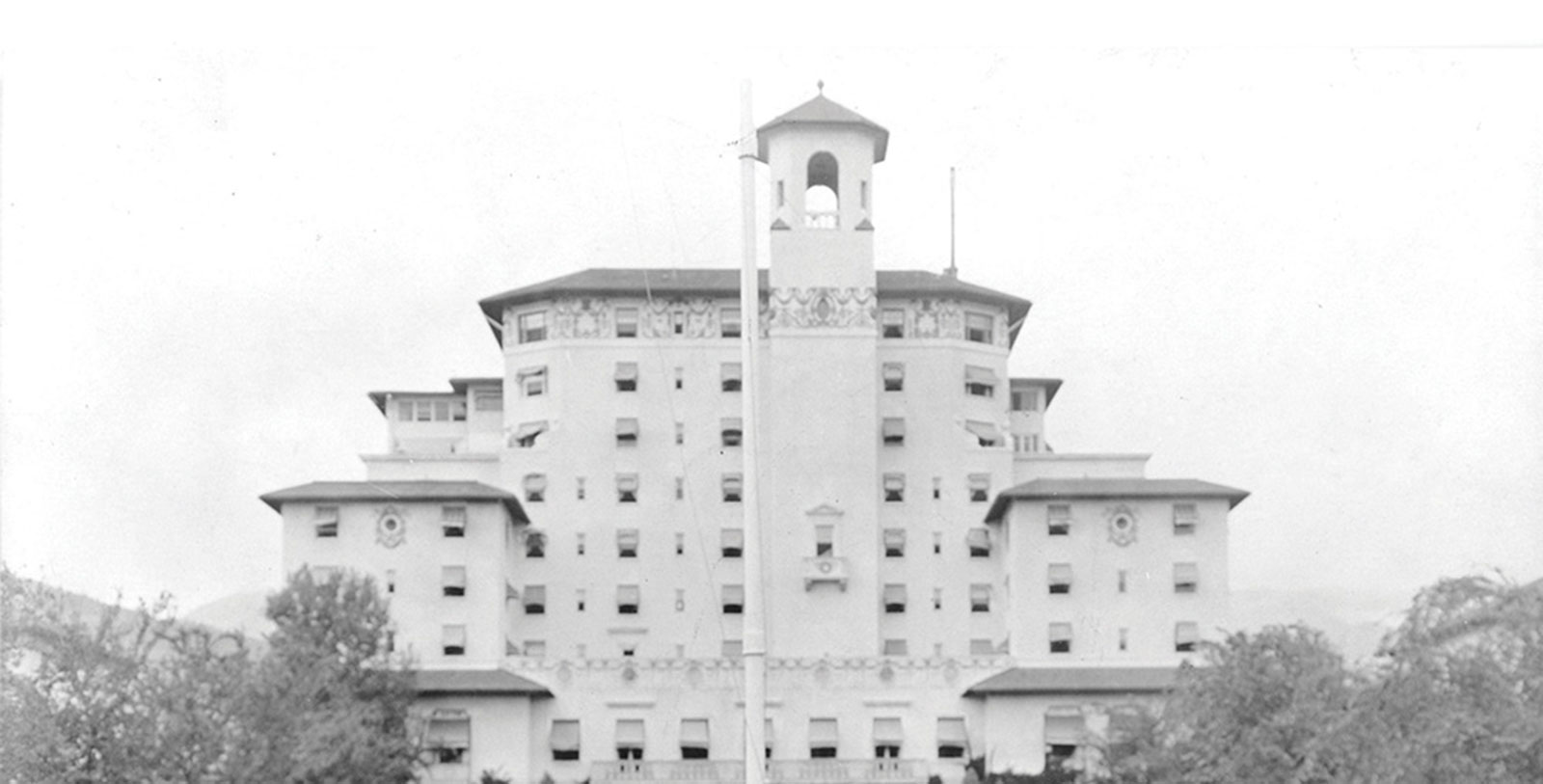 a large white building with a tower