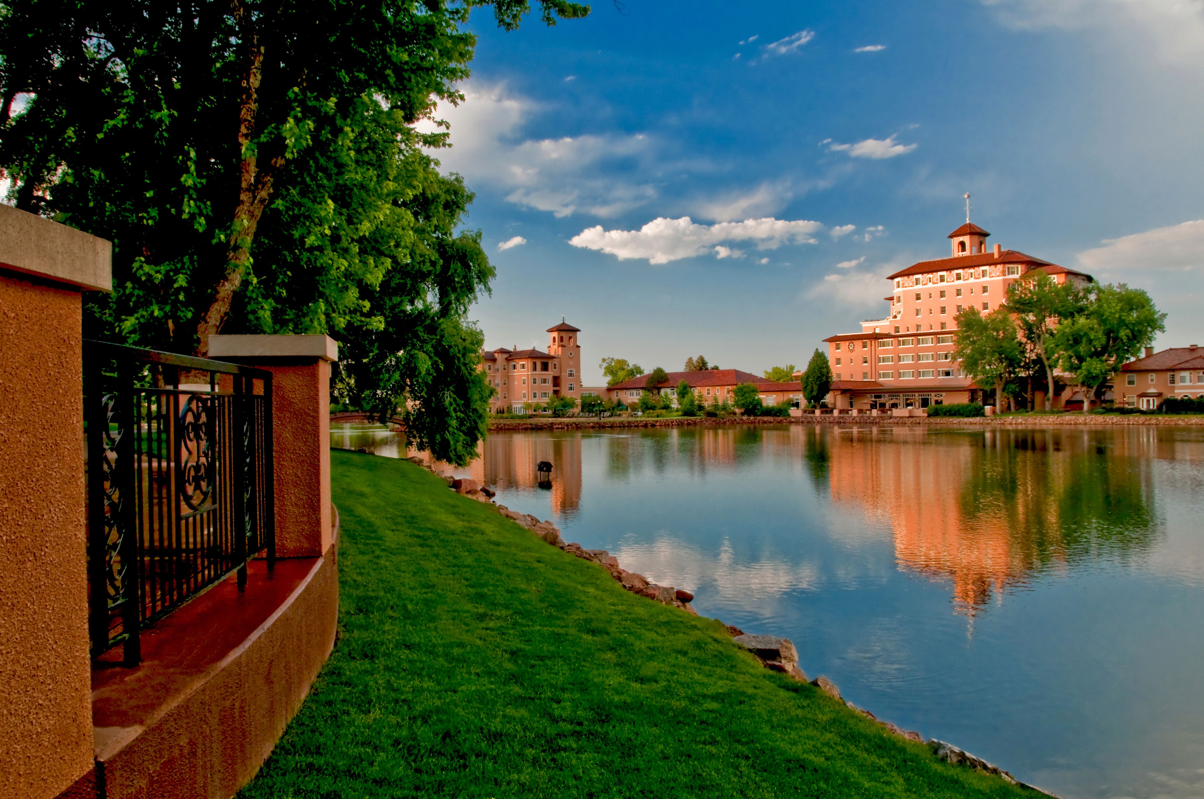 a body of water with buildings and trees