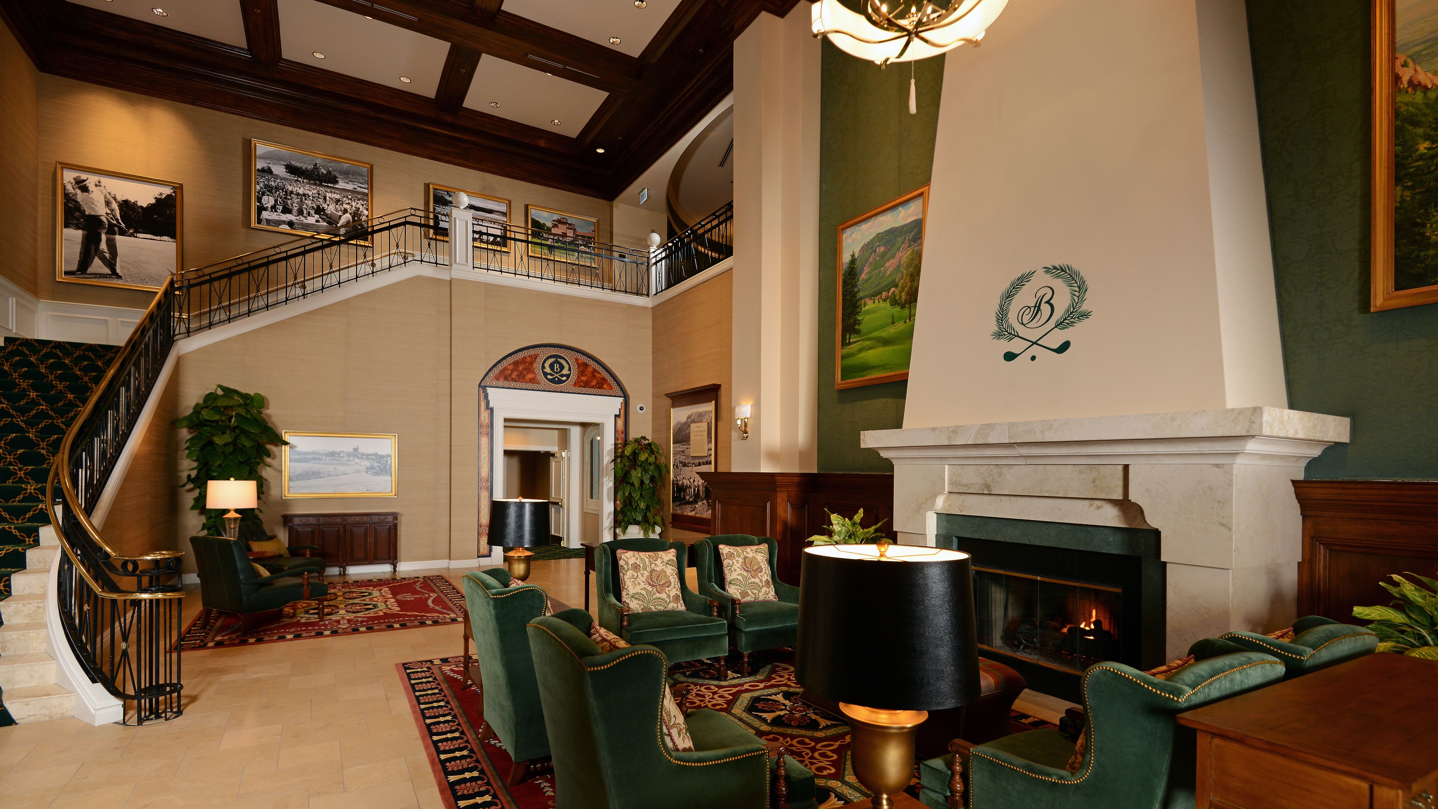 a room with a fireplace and chairs
