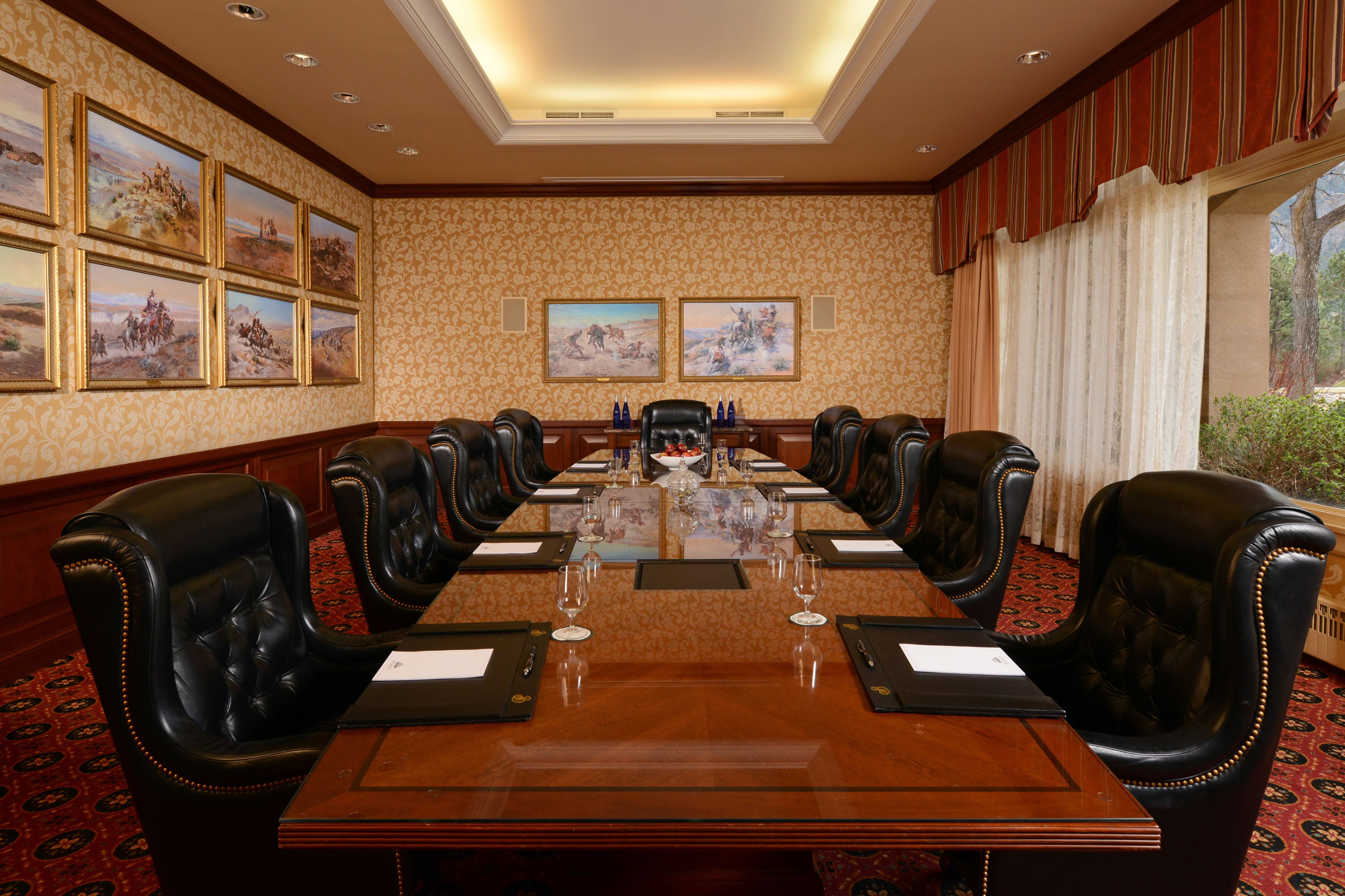 a conference room with a table and chairs