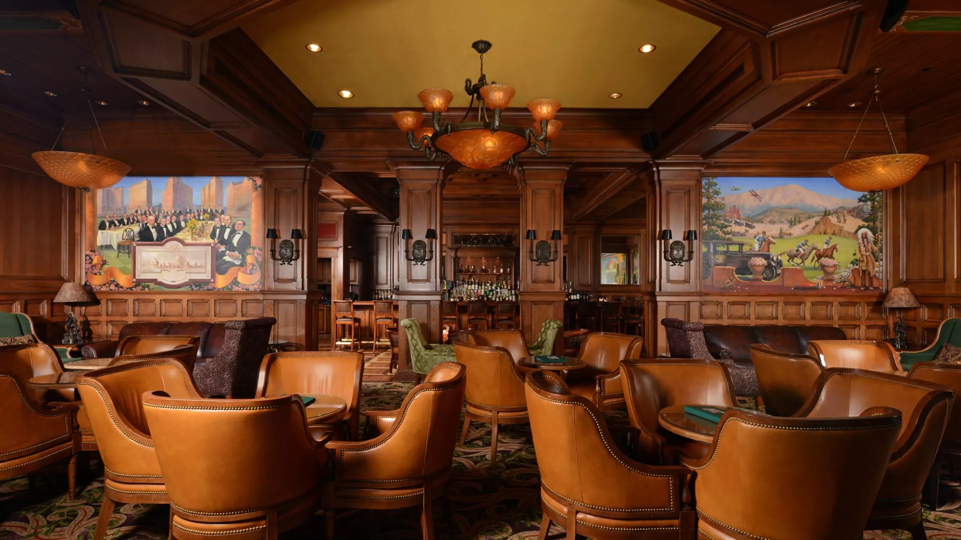 a room with a chandelier and chairs