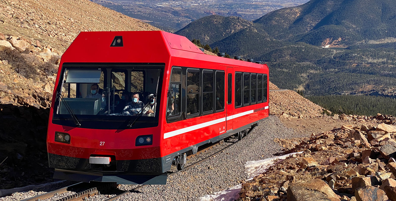 a red train on a mountain