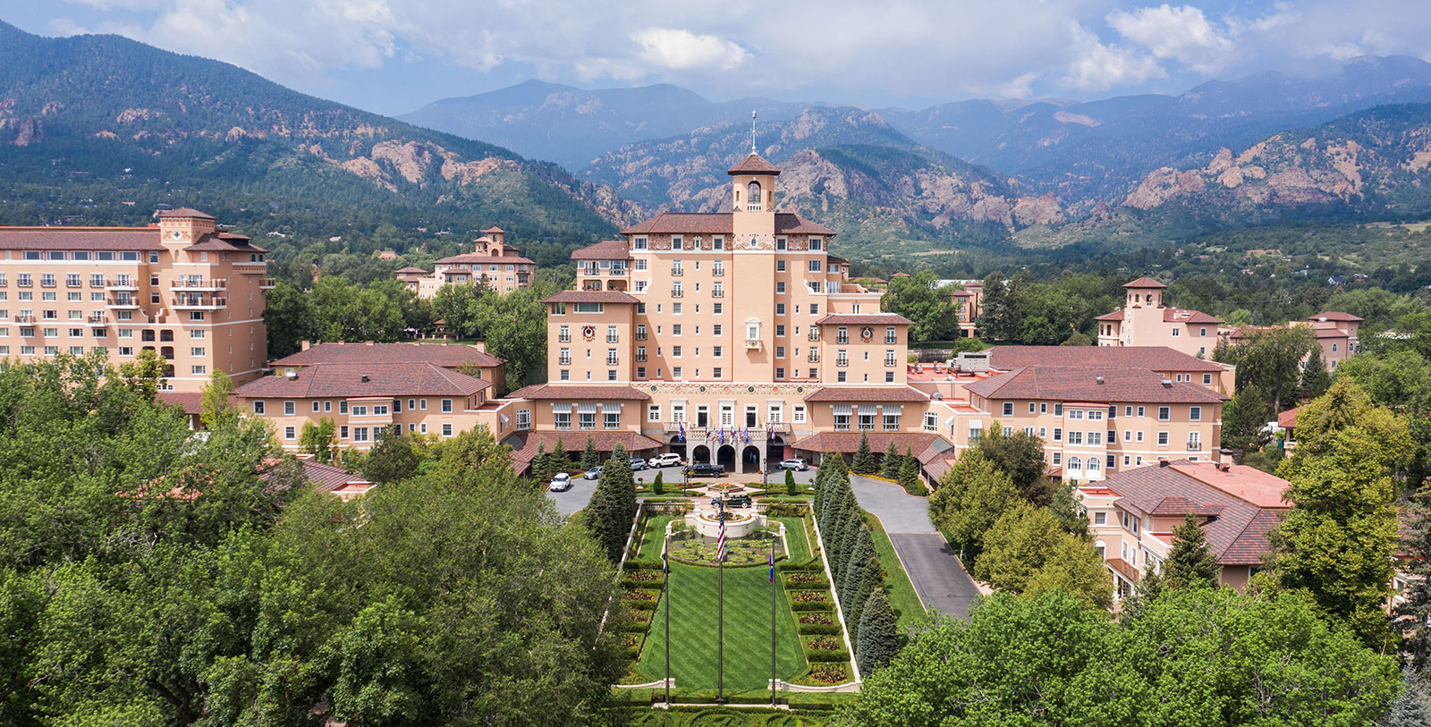 a large building with a lawn and a lawn in front of it