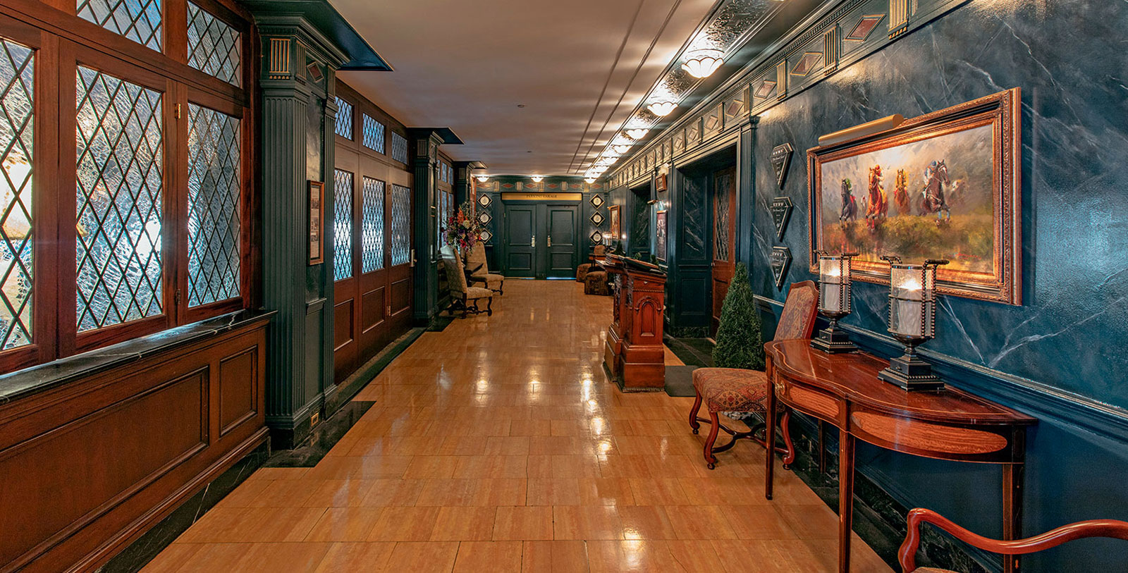 a hallway with a wood floor and a wood floor