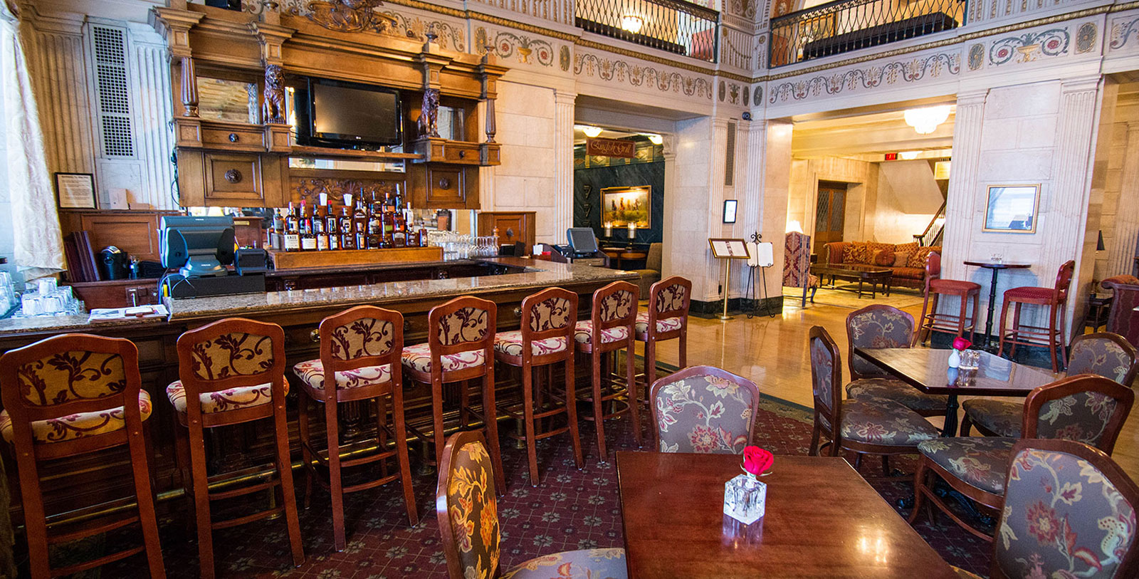 a room with a bar and a table