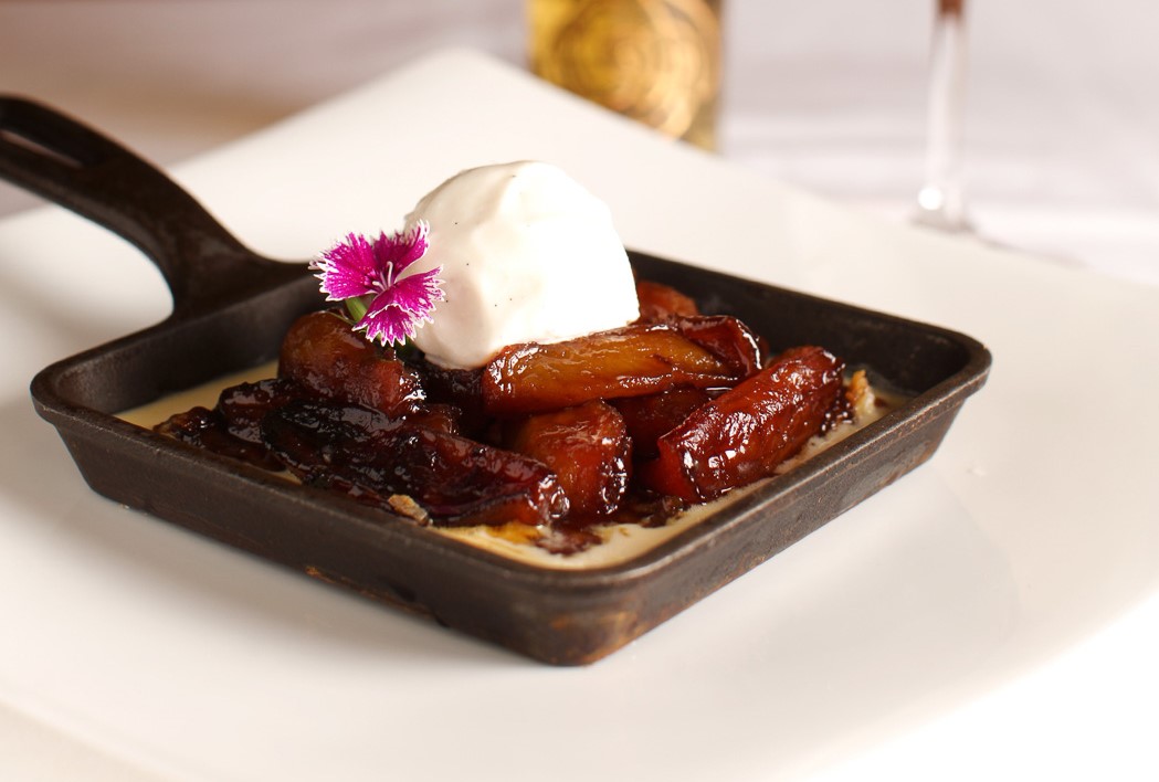 a plate of food with a flower on top