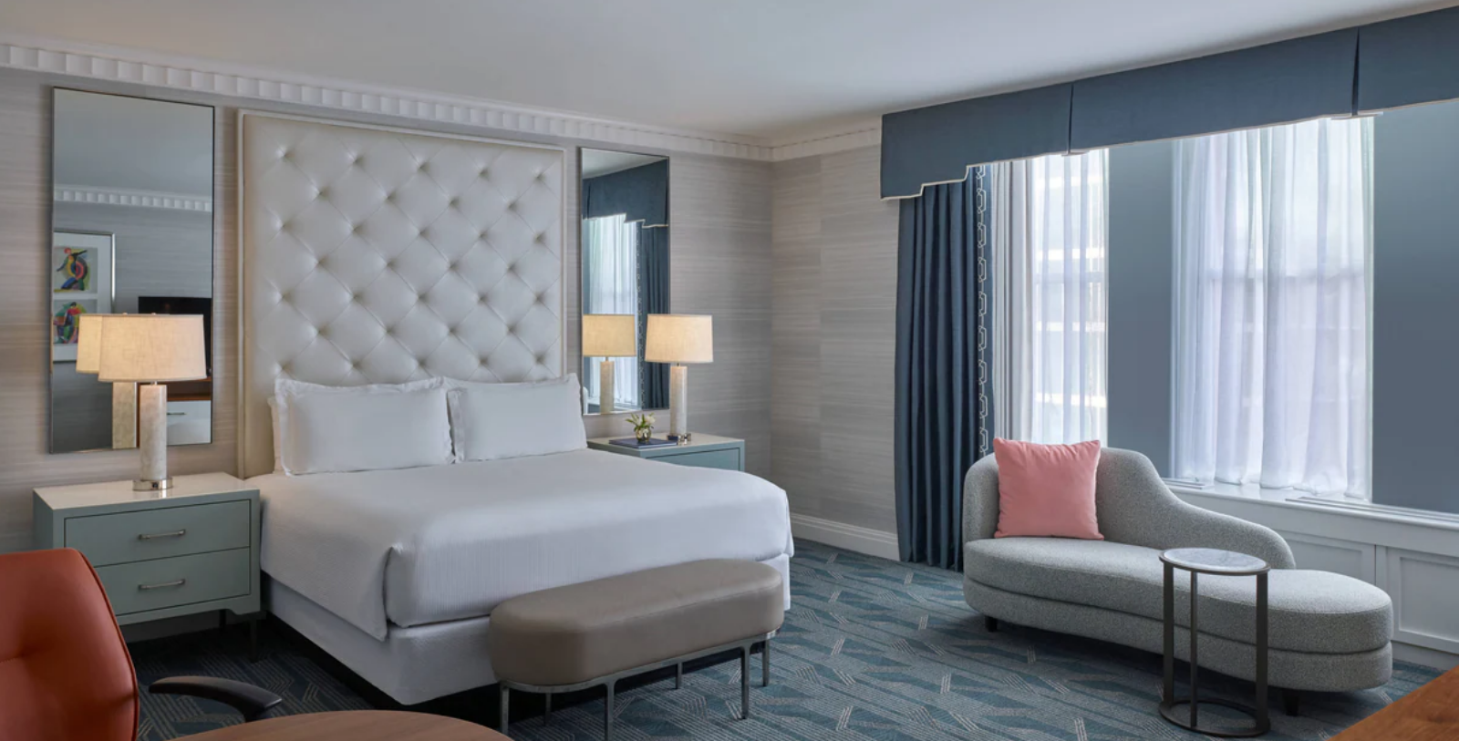 a room with a bed and a chair