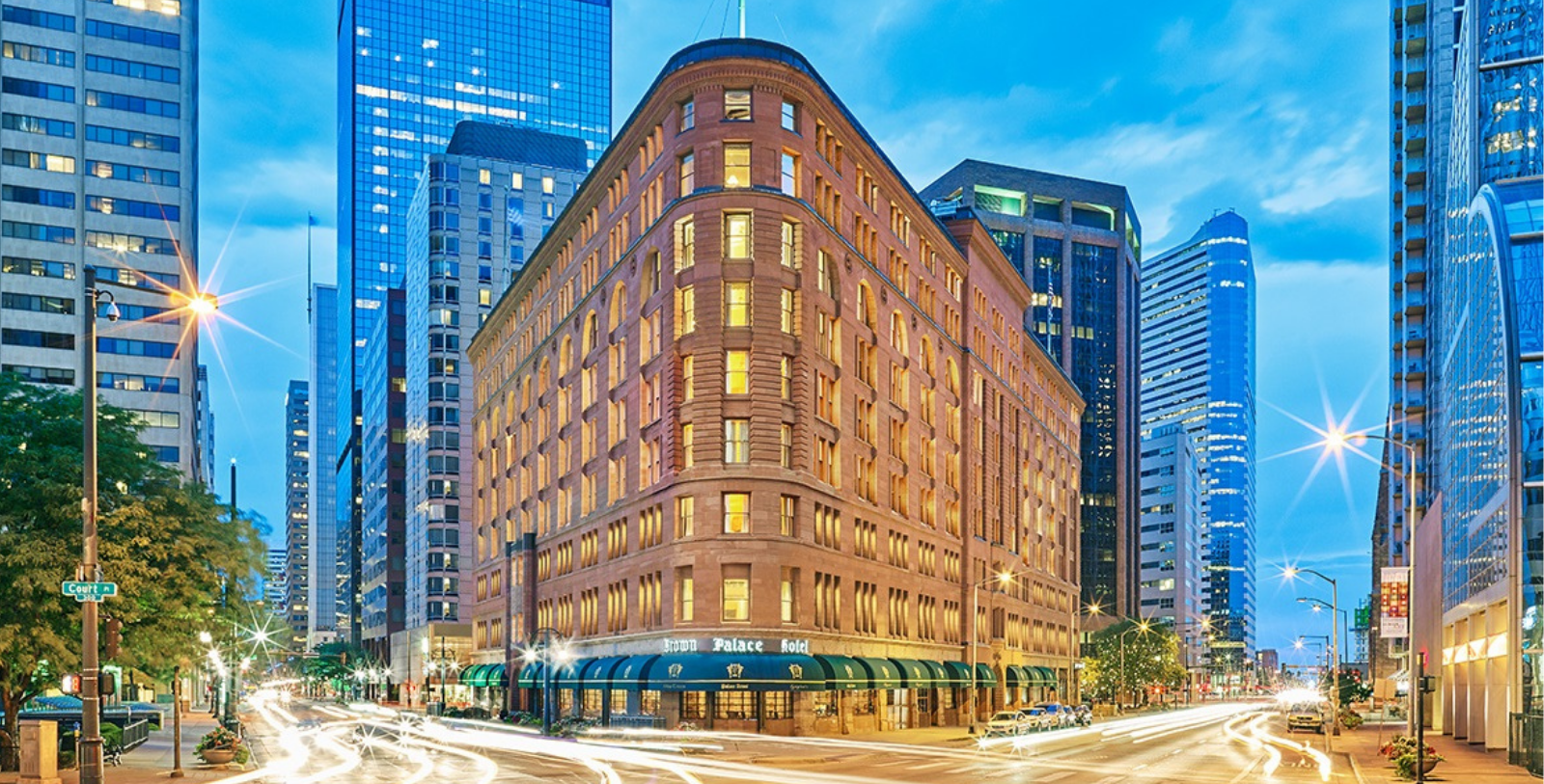 a building with many windows and a street in the background