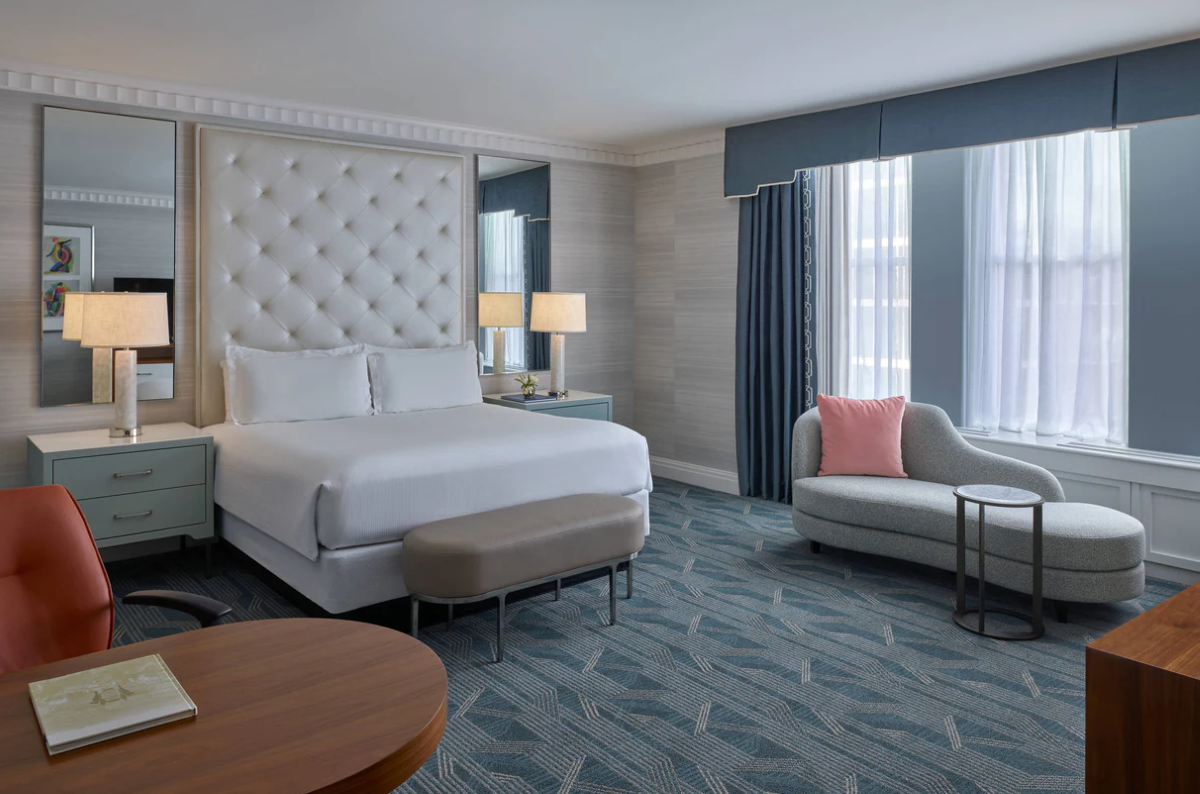a room with a bed and a chair