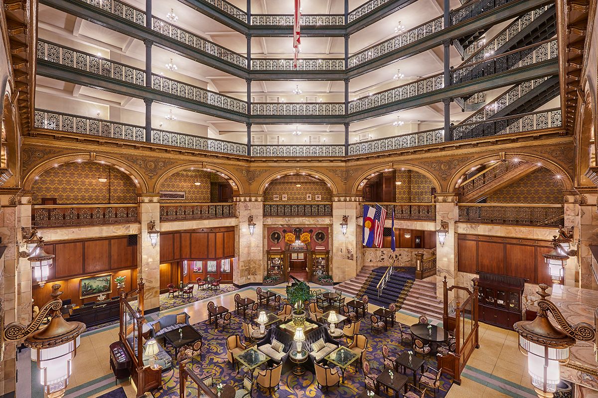 a large building with many balconies and tables