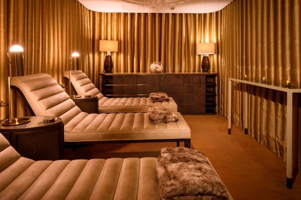 a room with brown chairs and a table