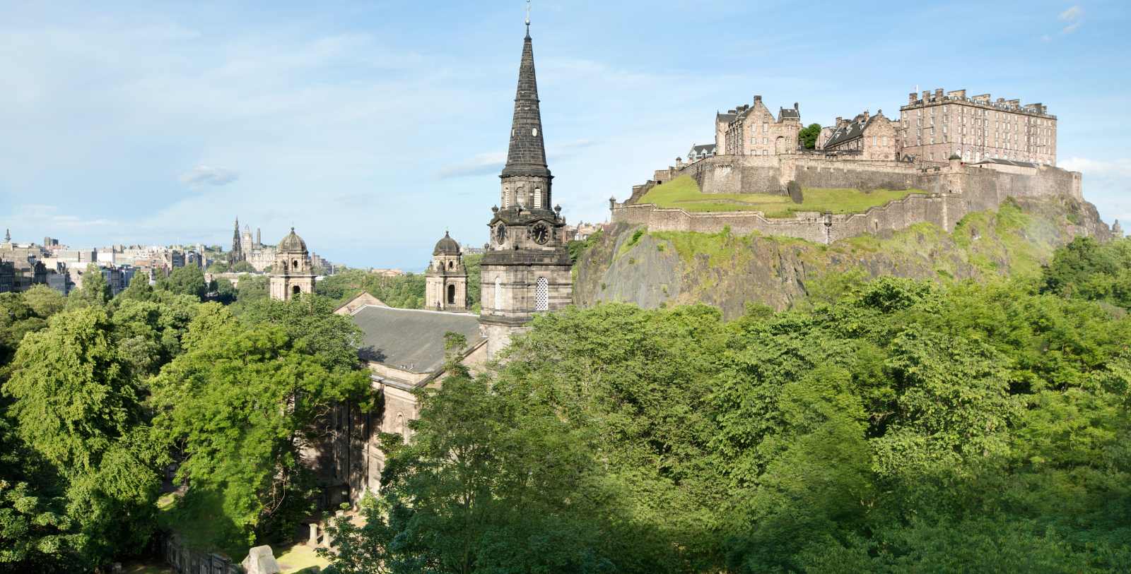 a castle on a hill with a steeple