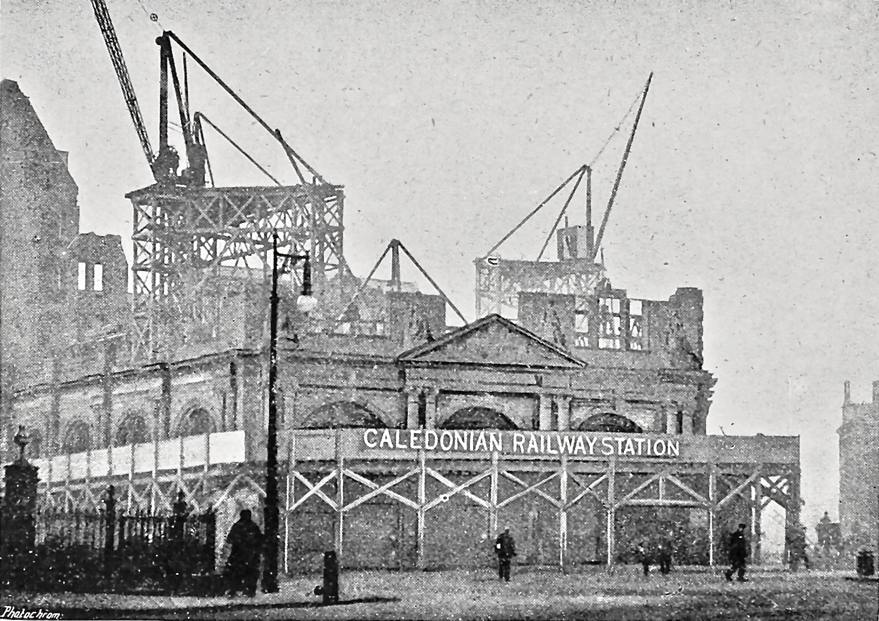 a building under construction with cranes