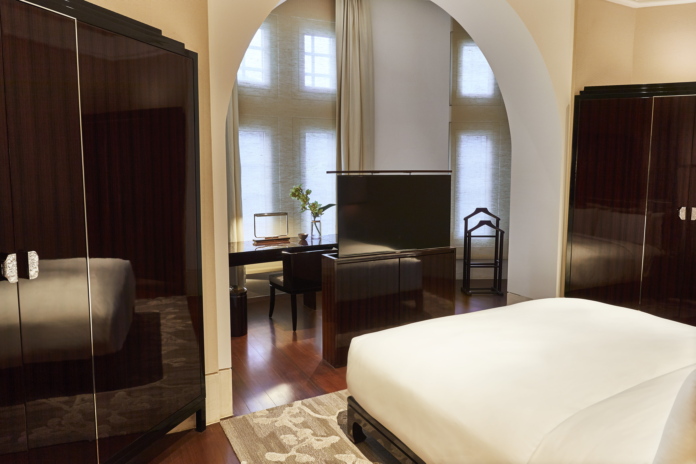 a room with a desk and a bed