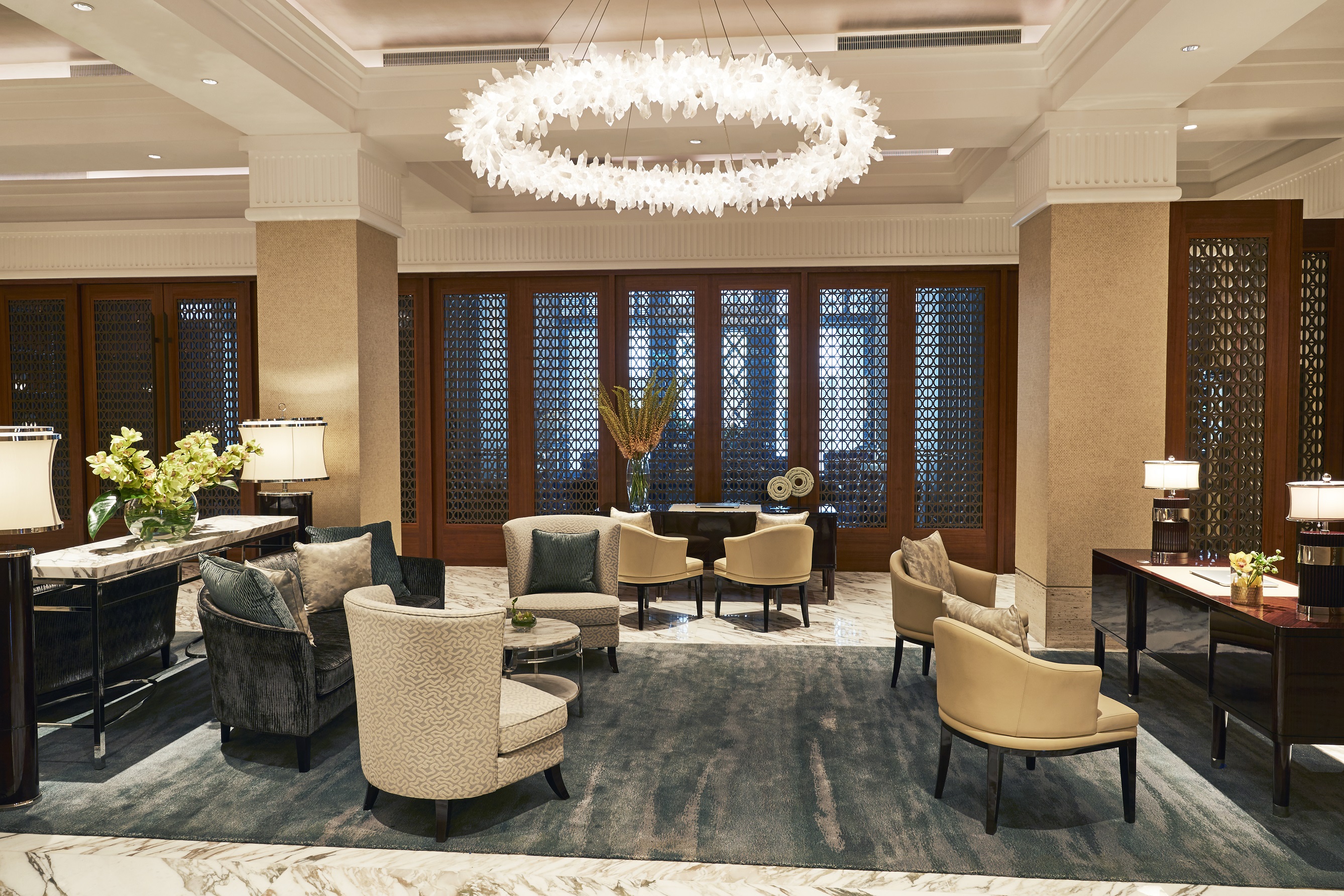 a room with chairs and a chandelier