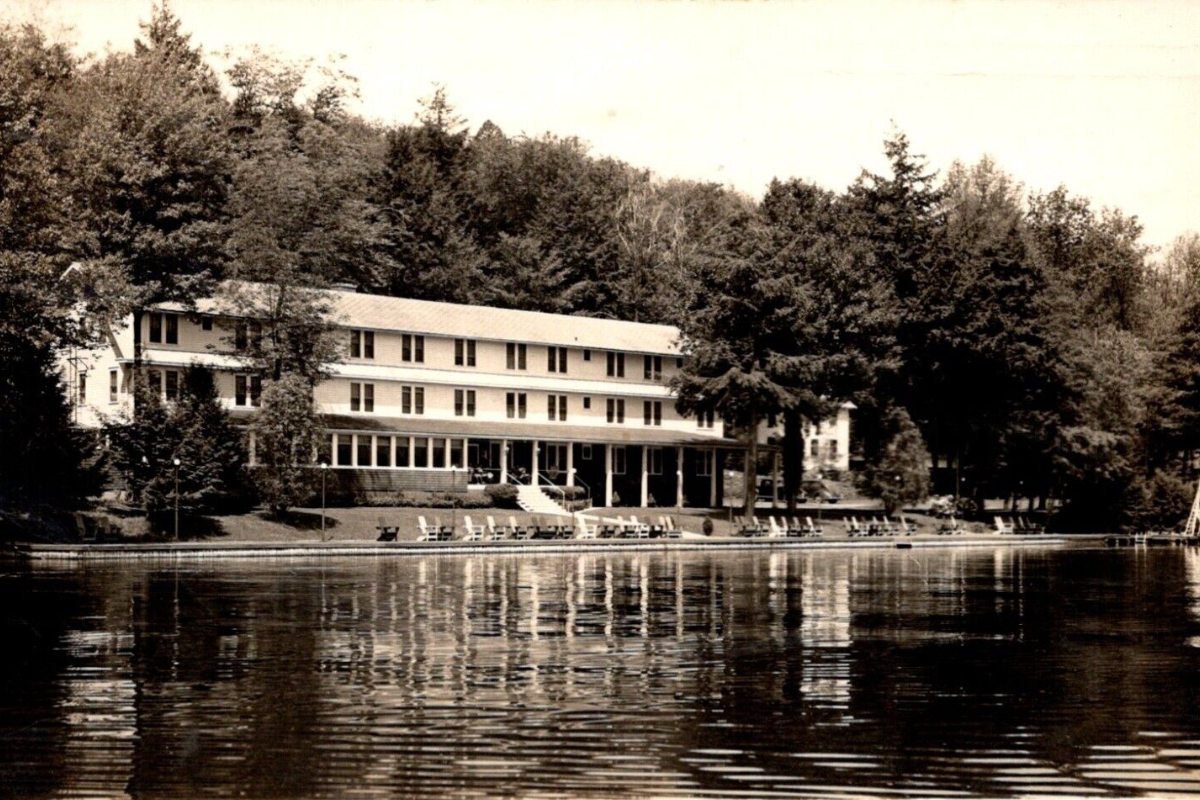 a building next to a lake