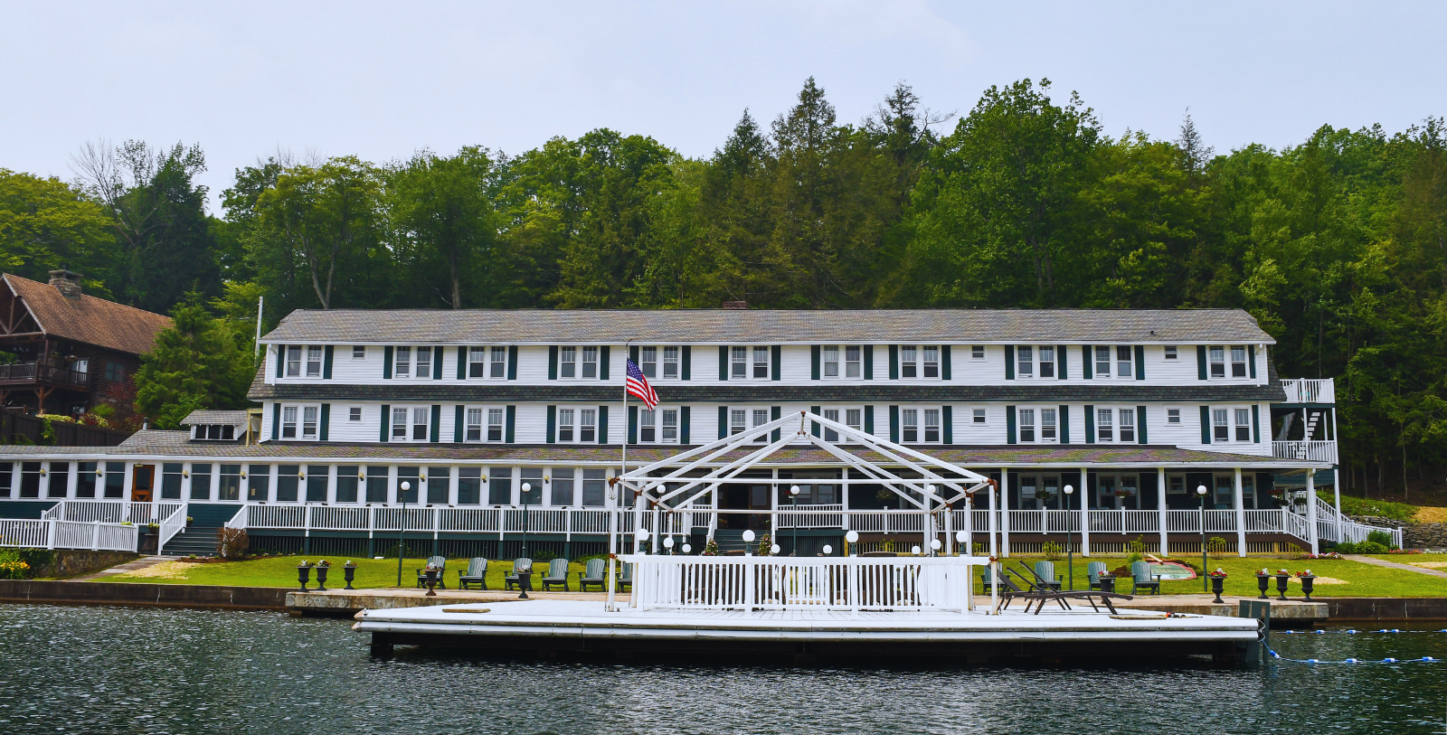 a white building with a flag on the front of it