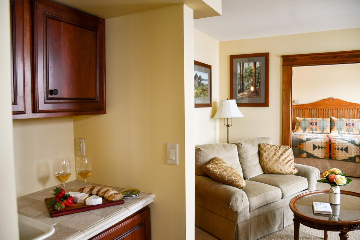 a room with a couch and a table with food on it