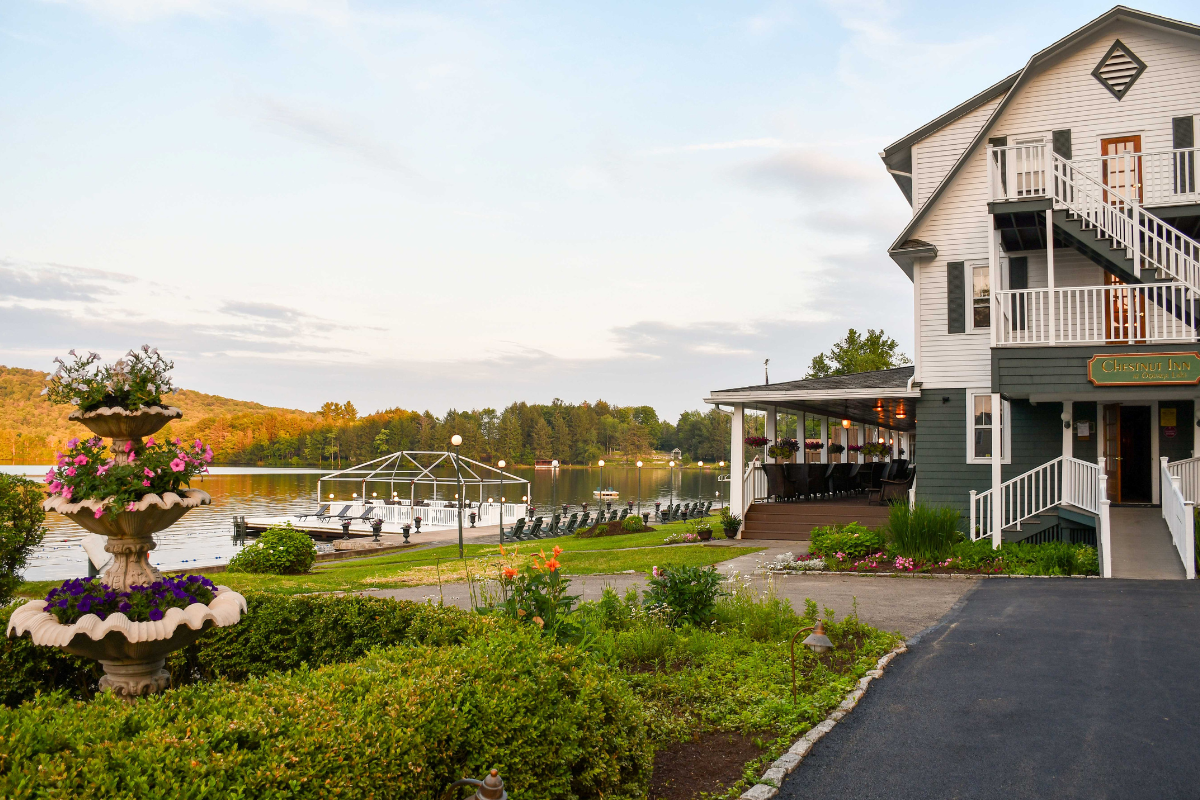 a house with a lake and a boat