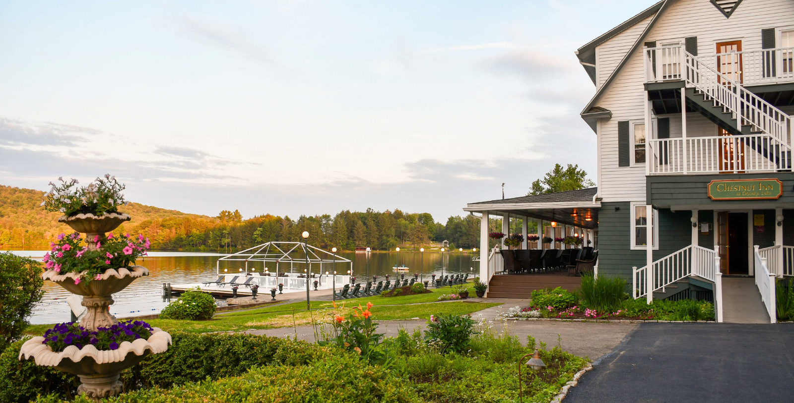 a building with a large deck and a lake