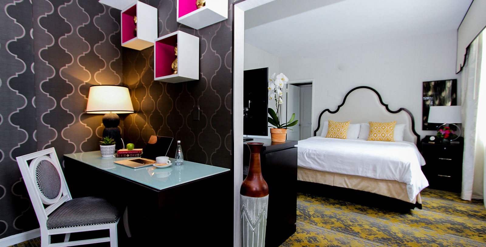 a room with a bed and a desk