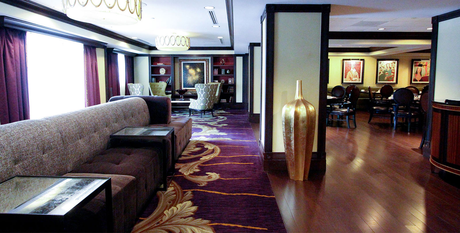 a room with a couch and a purple carpet