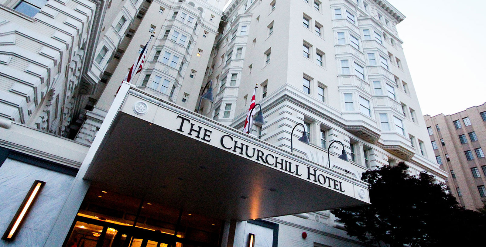 a large white building with a sign above it