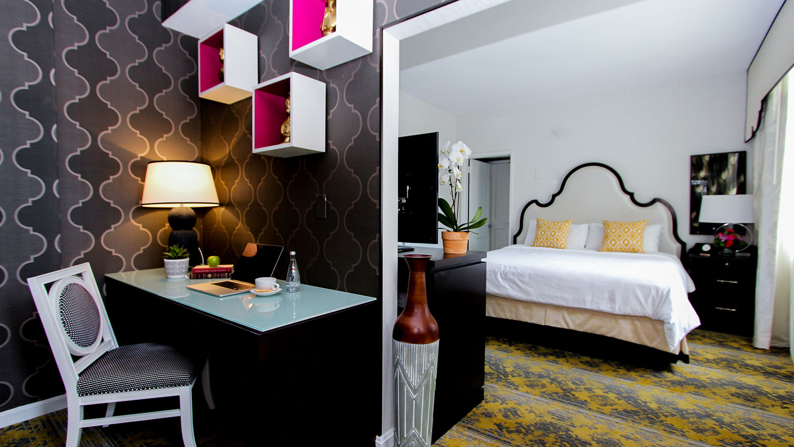 a room with a bed and a desk