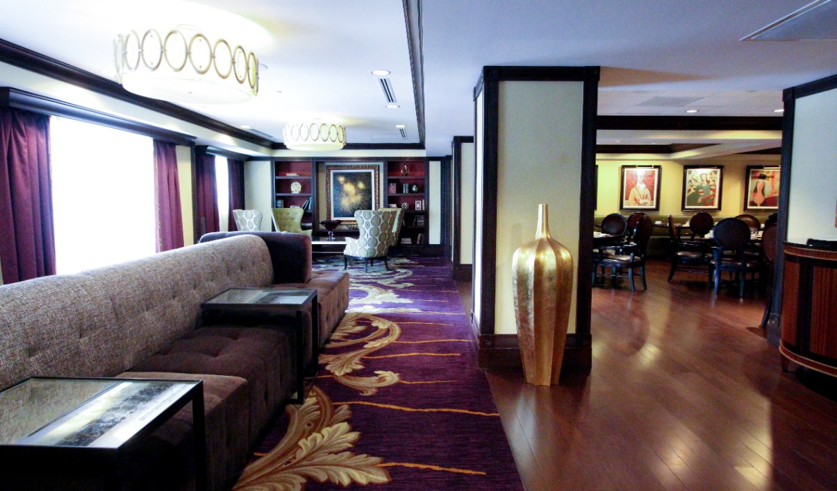 a room with a couch and a purple carpet