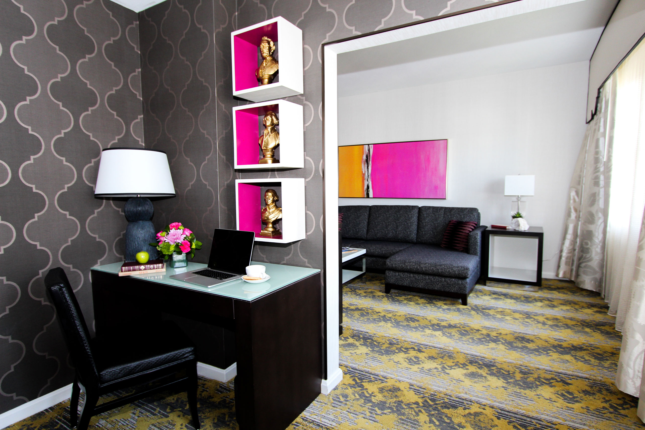 a room with a desk and a couch