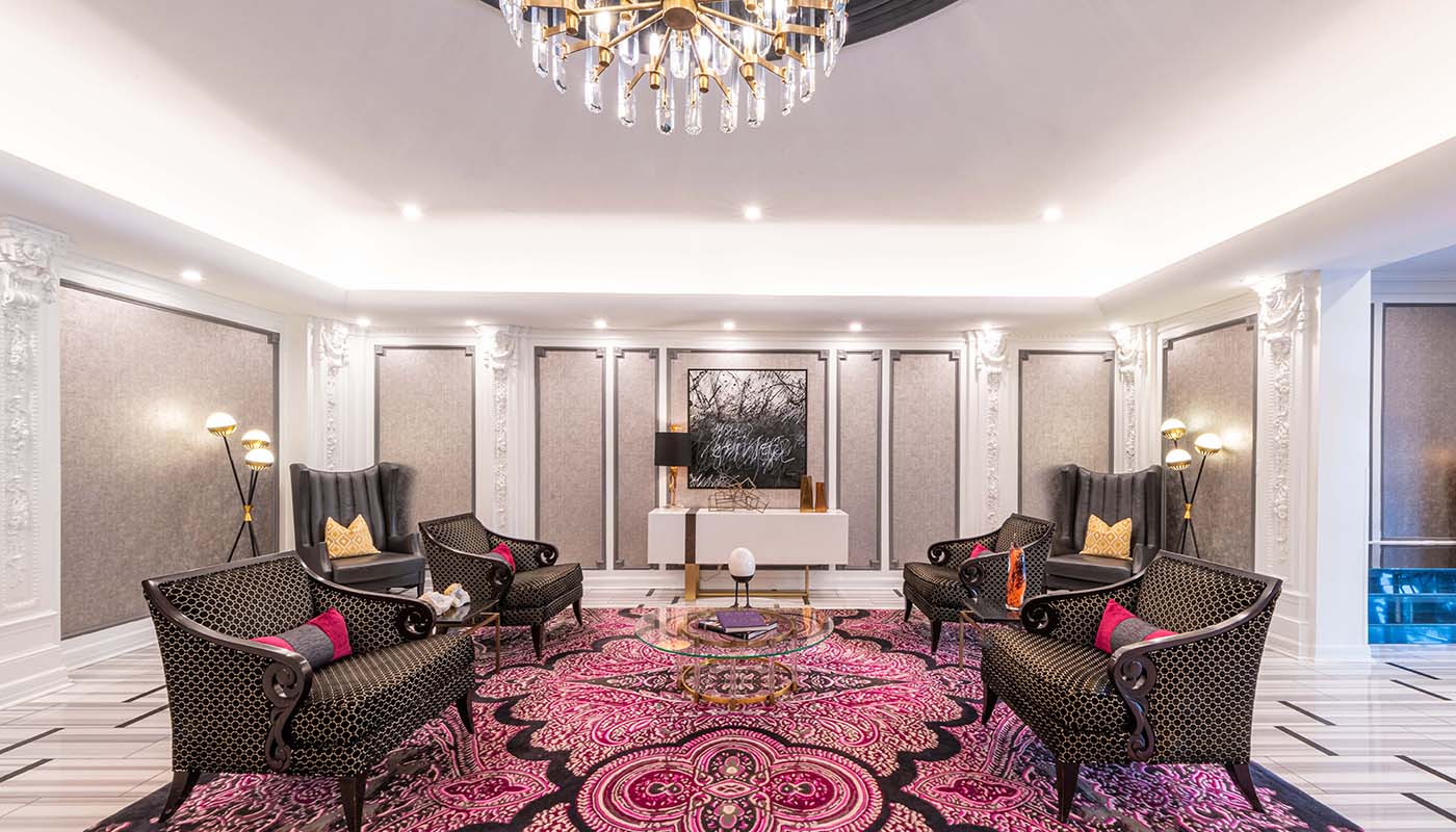 a room with chairs and a chandelier