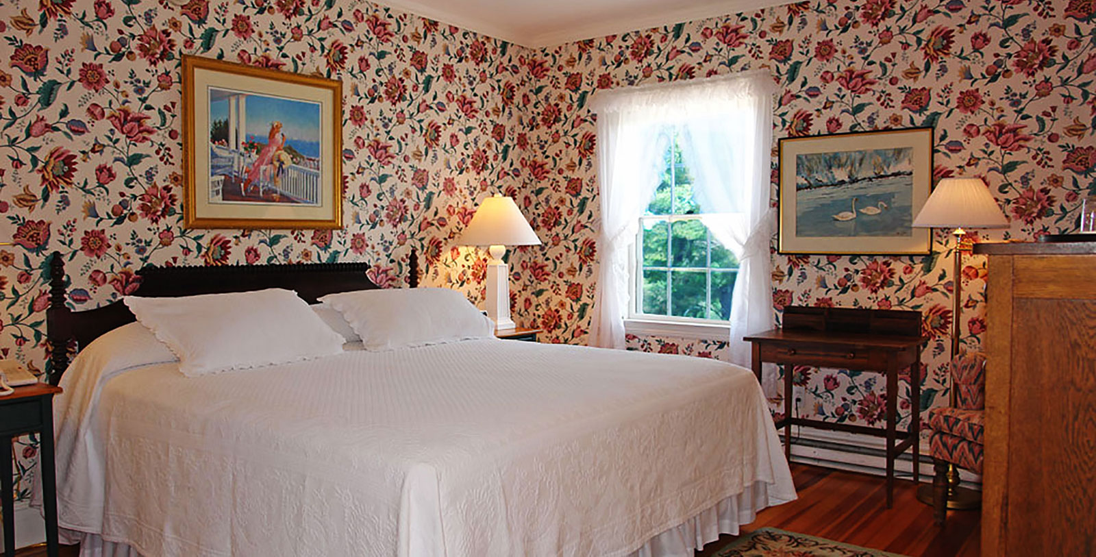 a bedroom with a bed and a lamp