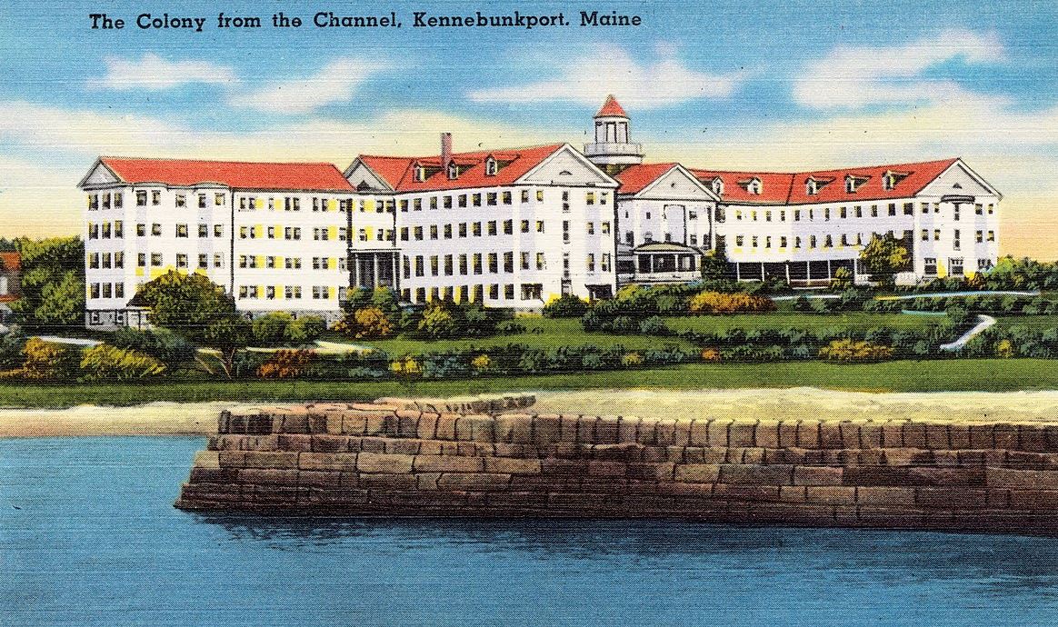 a large white building with red roofs