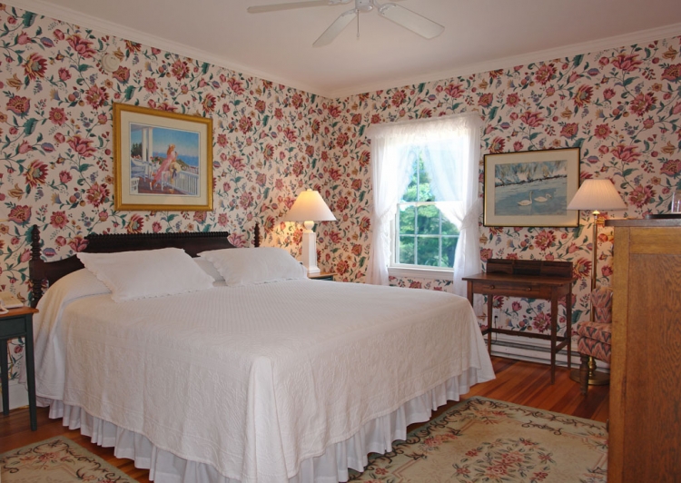 a bedroom with a bed and a table