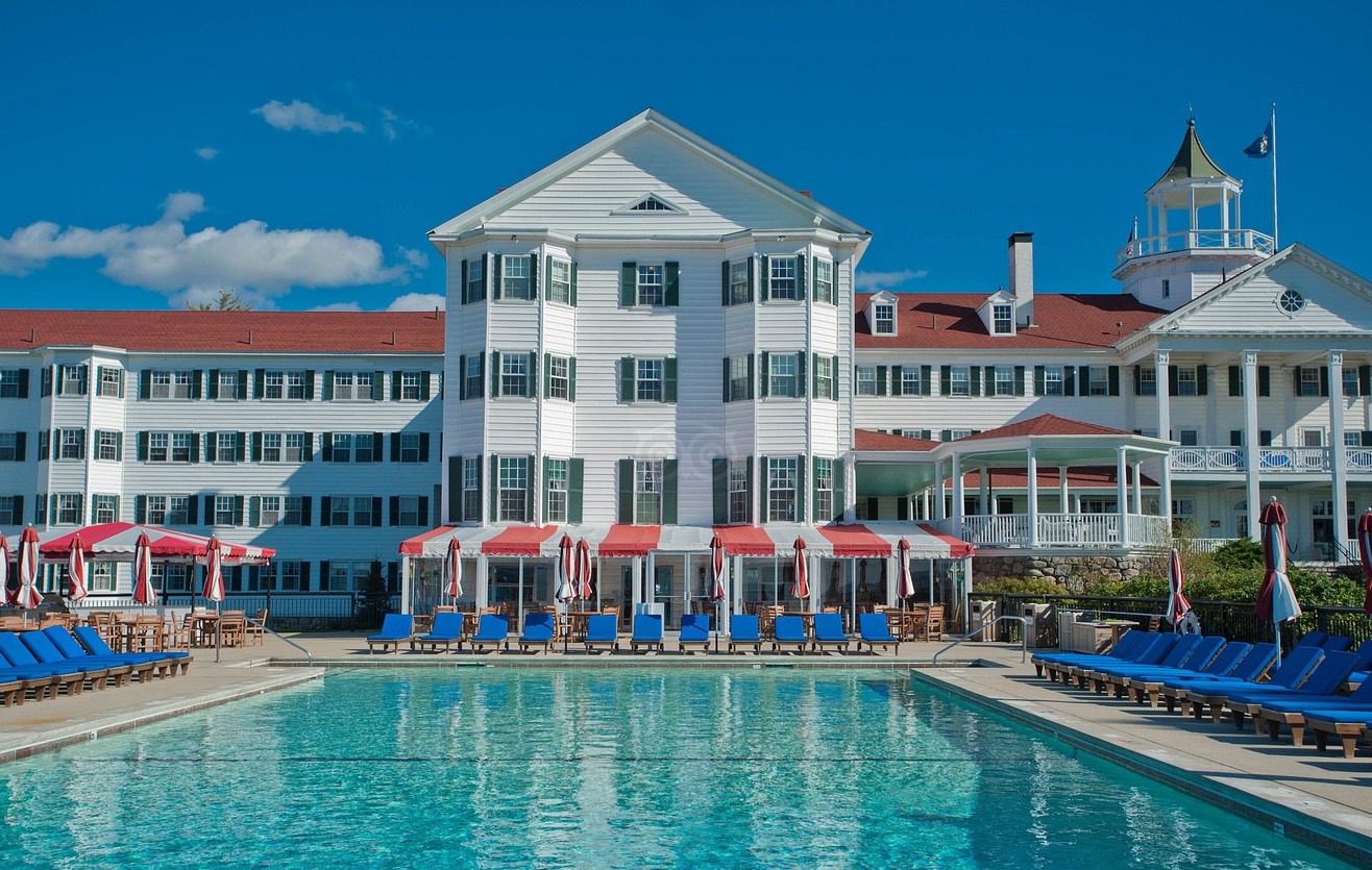 a pool in front of a large building