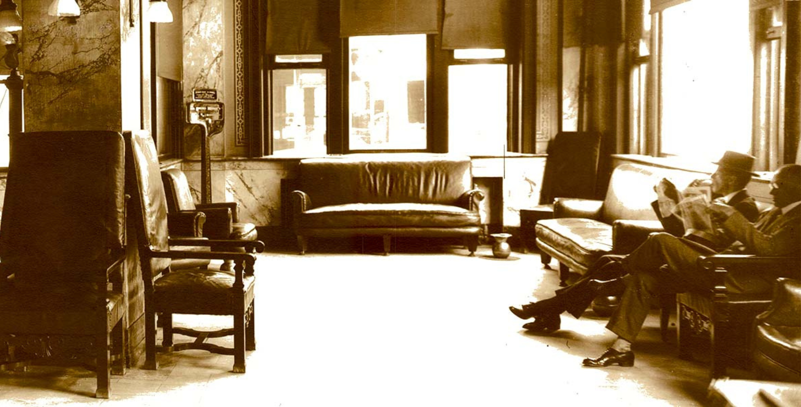 a man sitting in a room with a couch