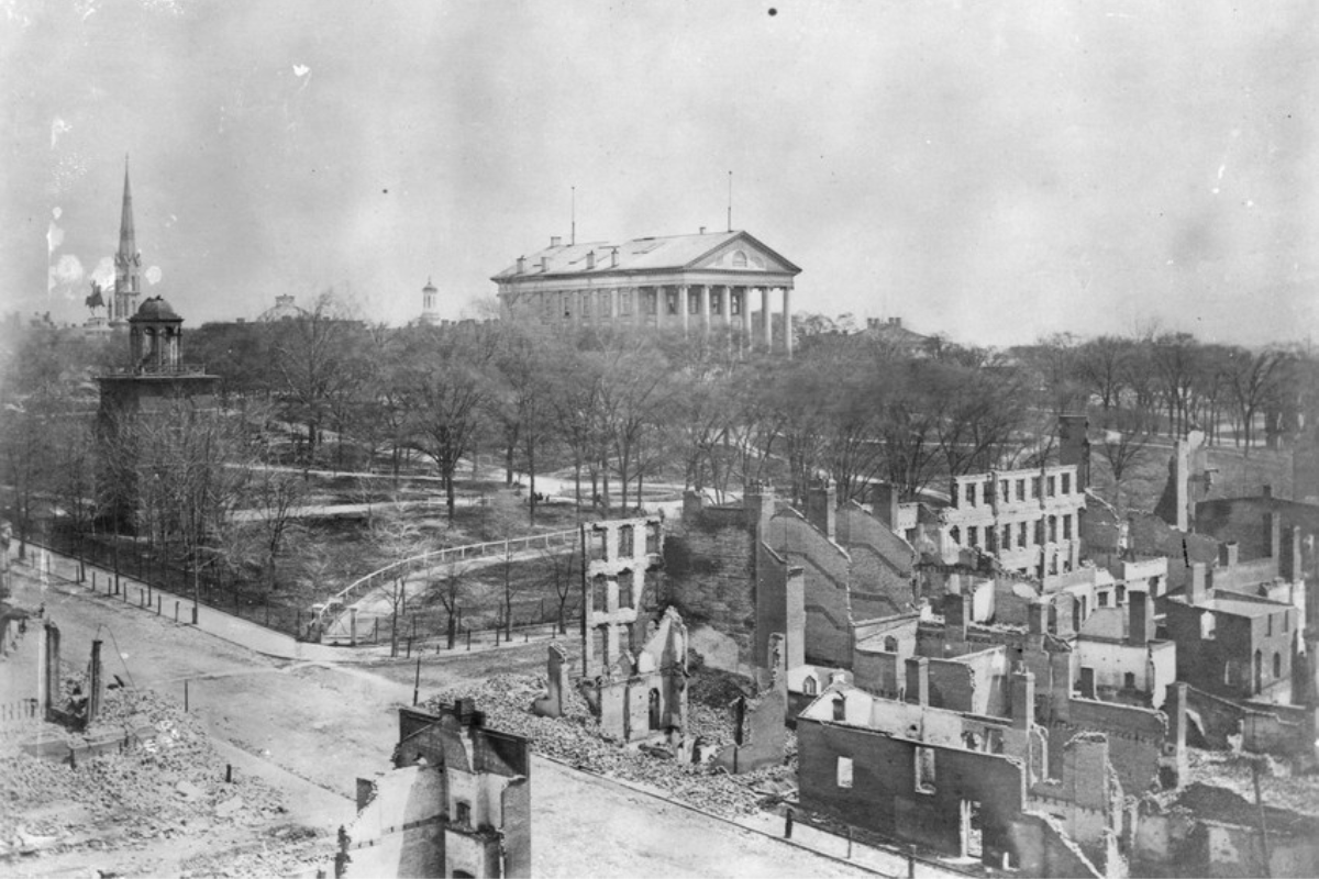 a black and white photo of a building in the distance